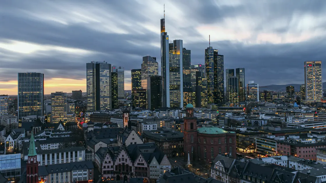 The Frankfurt skyline at dusk, the banking towers above the old town